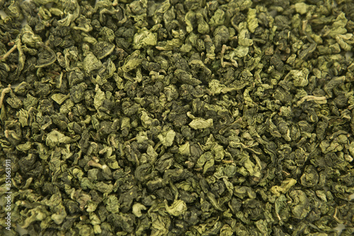 Chinese green tea. Tea to normalize the pressure. Tea background, texture. Blank for label or design. photo