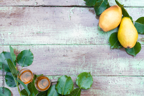 Pear rakija in glasses with decoration