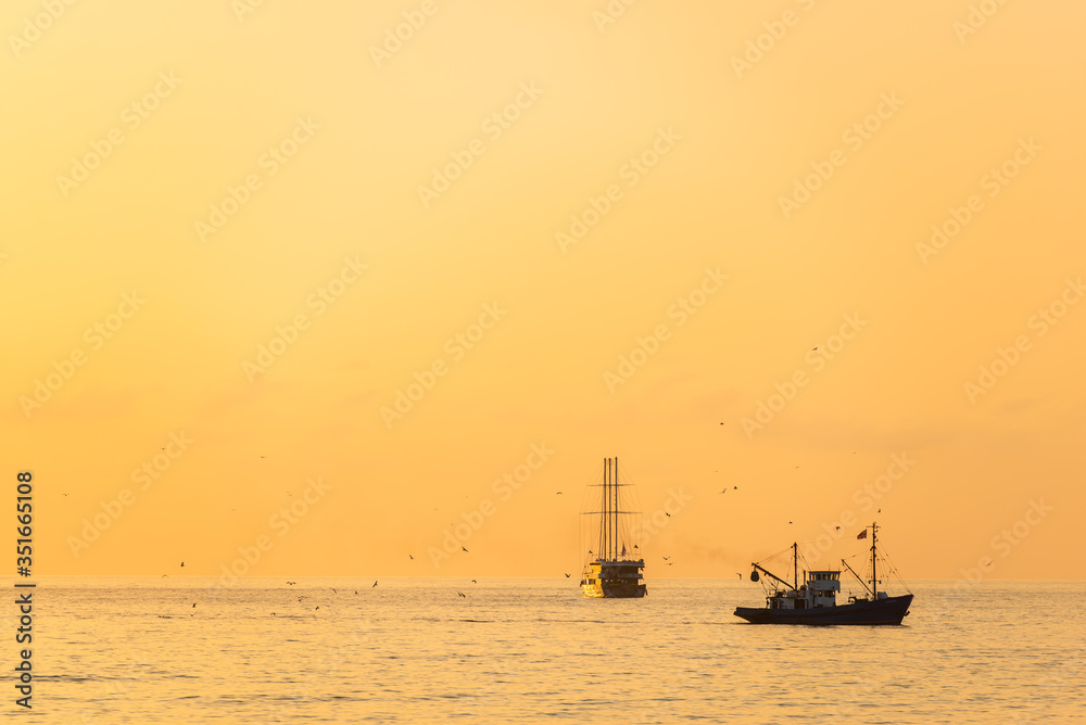 Fishing ship at sunset time in the Black Sea