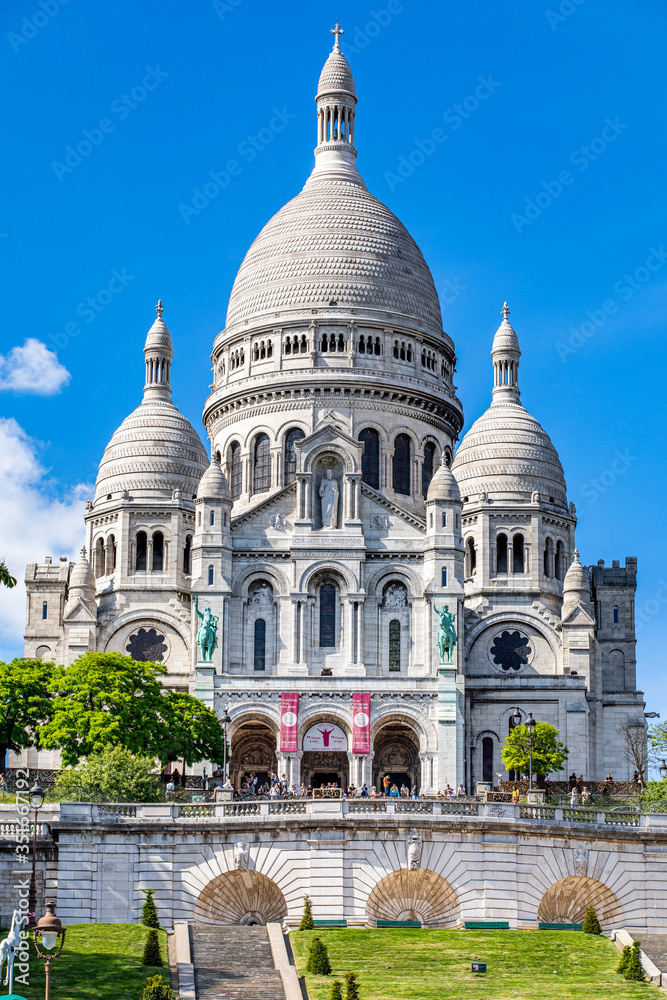 Paris, France - May 20, 2020: Basilica Sacre Coeur in Montmartre in Paris Paris, France - May 20, 2020: Basilica Sacre Coeur in Montmartre in Paris