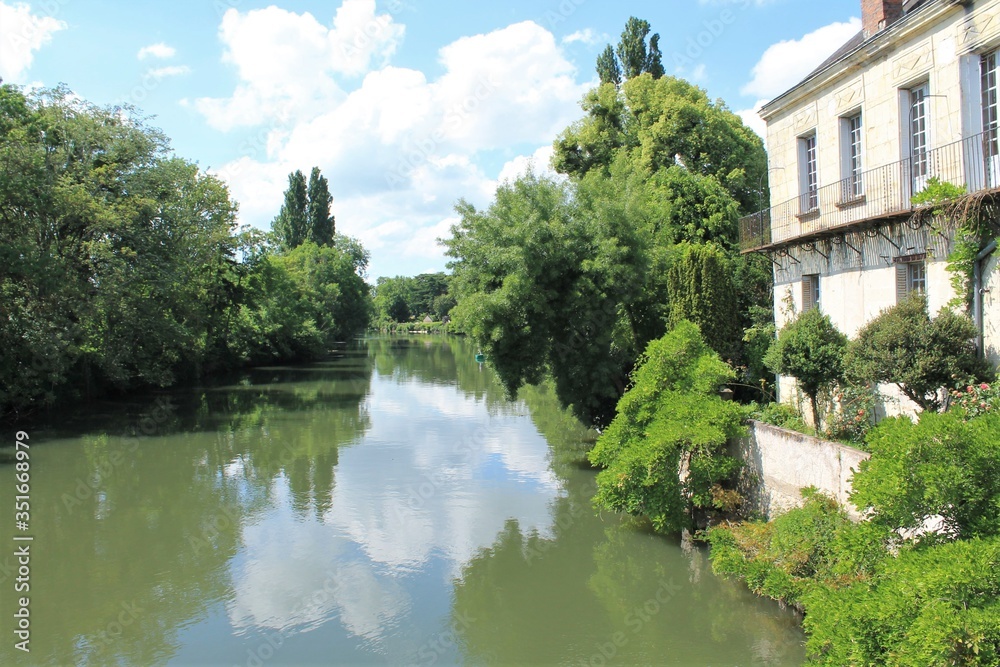 Beautiful reflection in river Loir in Montoire sur le Loir village near Lavardin, Loir et Cher, France