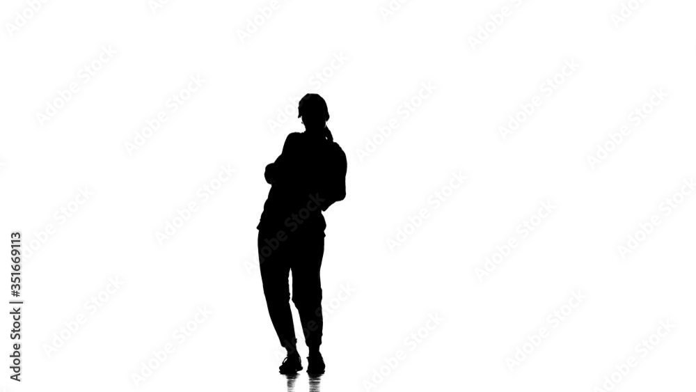 black silhouette on a white background, young beautiful woman dancer dancing hip hop, contemporary, modern street dance, slow motion black silhouette on a white background, young beautiful woman dancer dancing hip hop, contemporary, modern street dance, slow motion