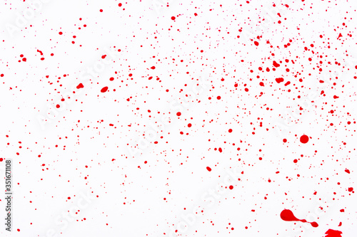Red paint splashes. Colorful red paint explosion on white background, texture