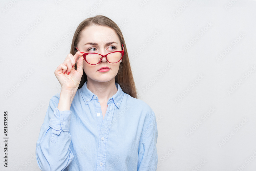 Nerd girl with red glasses, portrait, white background, copy space, 16: 9