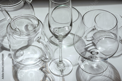 Different types of glassware are on a white surface.