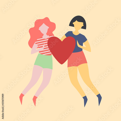 Two girls holding a heart together. Love between two girls. Same-sex interracial love. Love in the LGBT community.