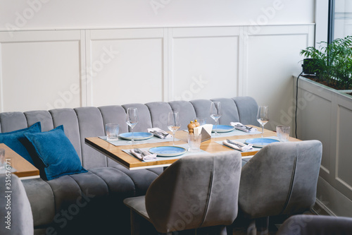 Table with glasses and plates in restaurant