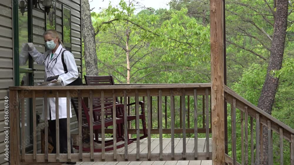 Tight shot of mature woman doctor or nurse wearing face mask and gloves making a house call home visit in a rural area. Tight shot of mature woman doctor or nurse wearing face mask and gloves making a house call home visit in a rural area.
