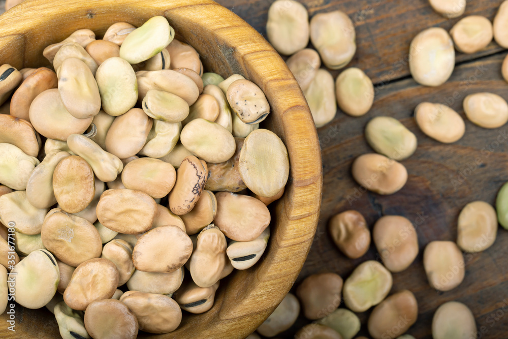 dry beans on a wooden background