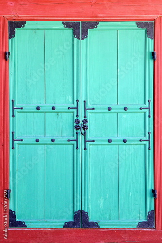 ancient door with bronze decoration