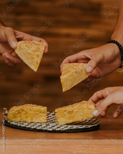 woman hands slicing tortilla