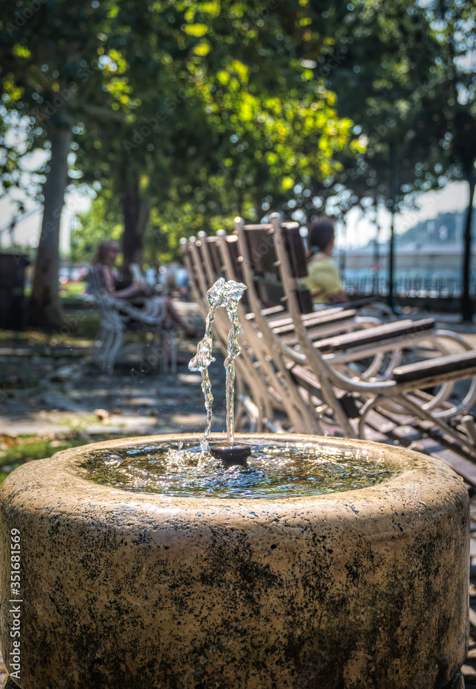  Pump room with mineral drinking water in the background of a city park in Budapest, Hungary
