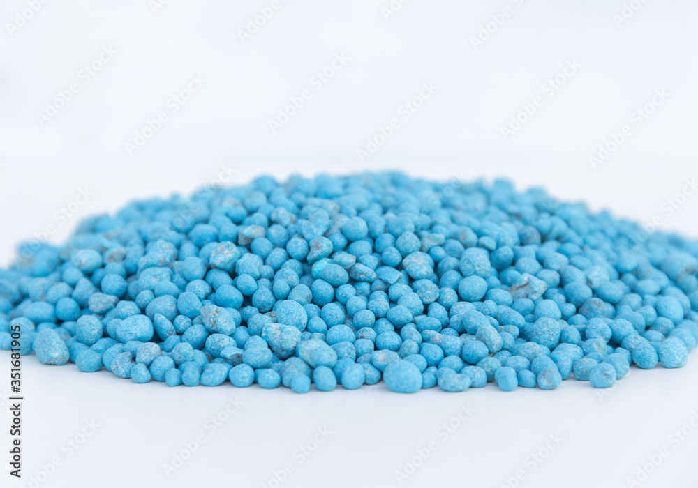 Blue chemical fertilizer on white background. Blue chemical fertilizer on white background.
