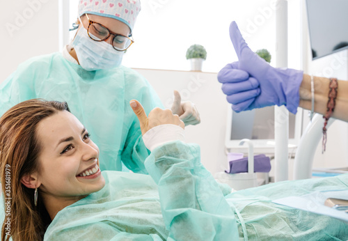 Dentists and patients gesturing thumbs up
