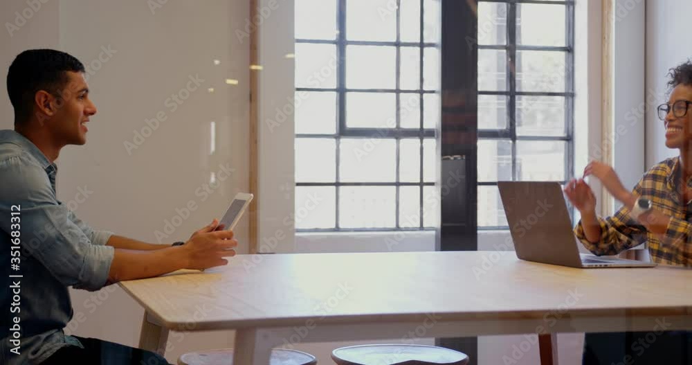 Business people interacting with each other in a modern office Business people interacting with each other in a modern office