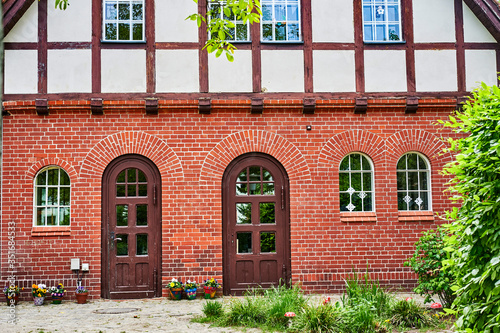 Former historic fire station with a brick facade and half-timbering in Berlin, Germany. photo