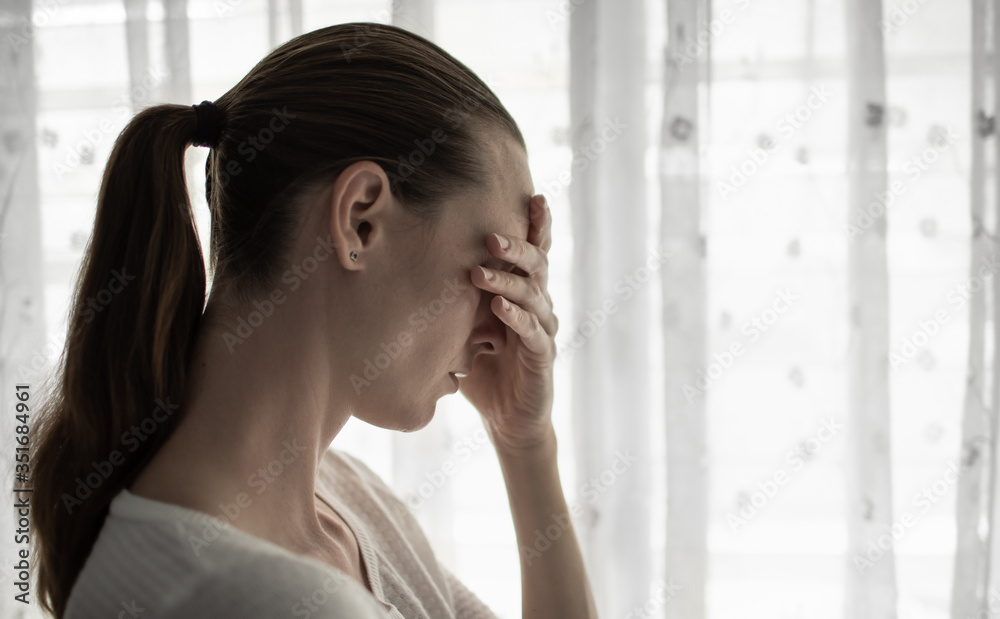 Young woman at home, feeling upset, and sad Young woman at home, feeling upset, and sad