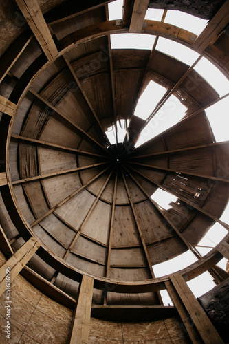  old roof of a dilapidated building against the sky. Roof hole