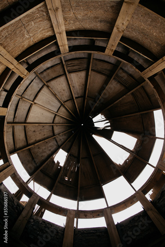  old roof of a dilapidated building against the sky. Roof hole