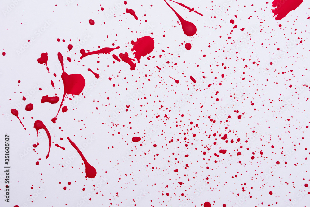 Fototapeta premium Red paint splashes. Colorful red paint explosion on white background, texture