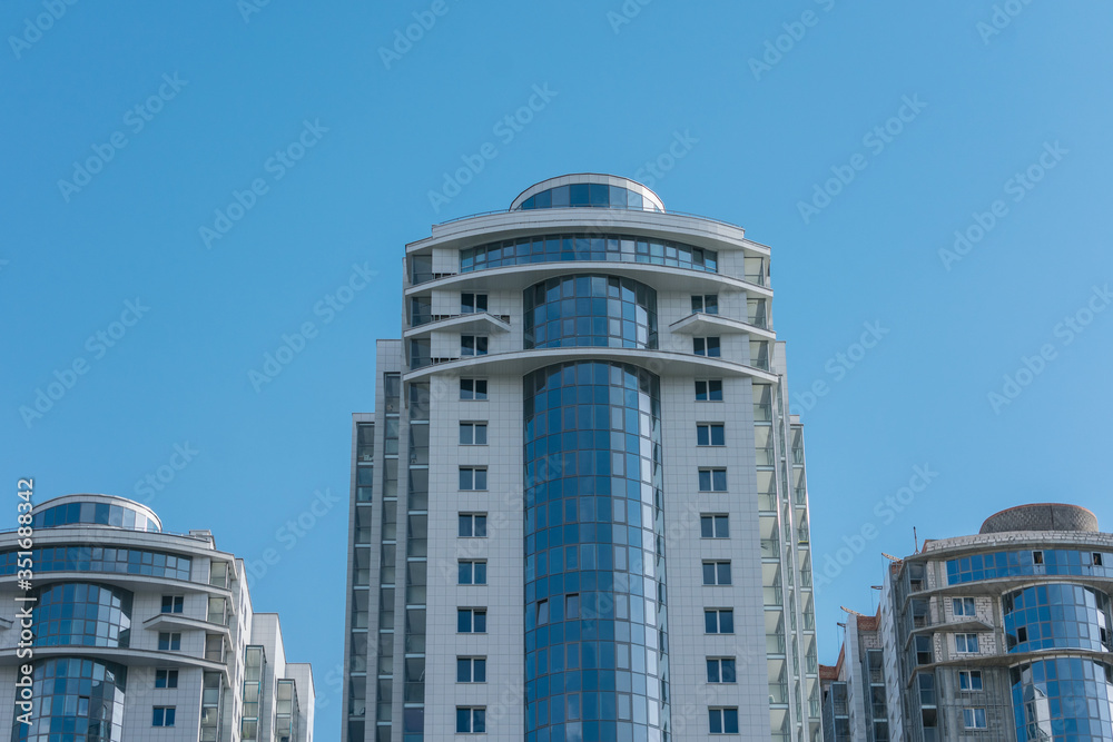 Apartment buildings, sunny day in the city, blue sky