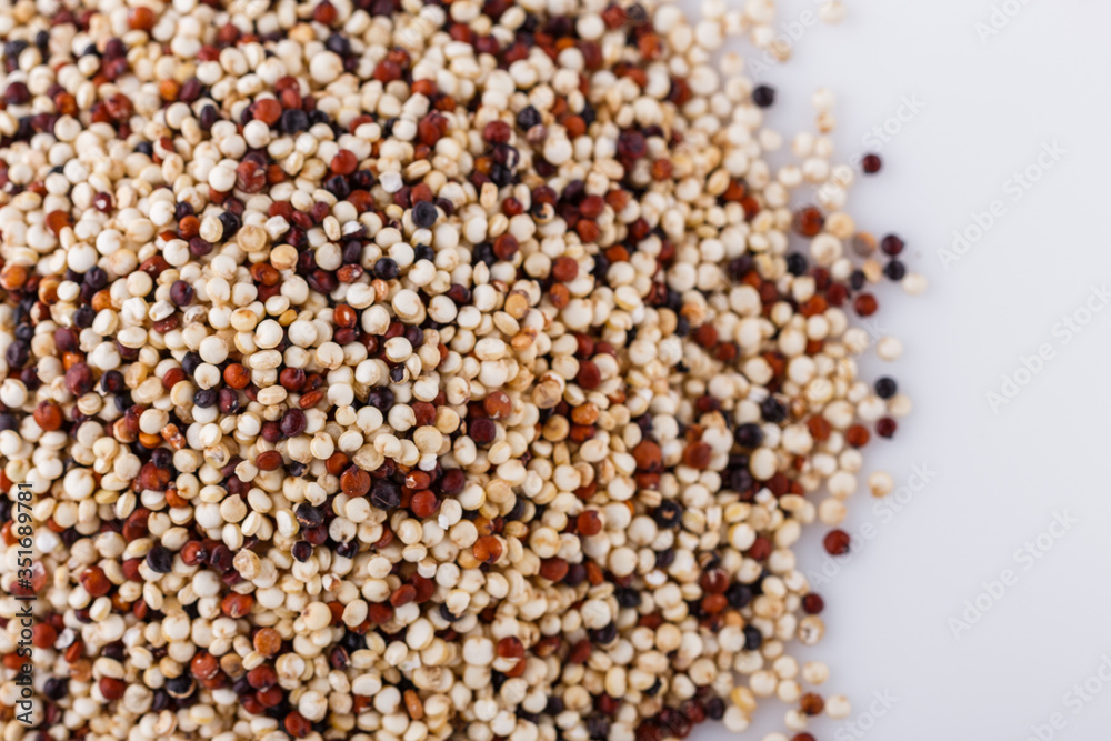 mix of quinoa grains on white acrylic background mix of quinoa grains on white acrylic background