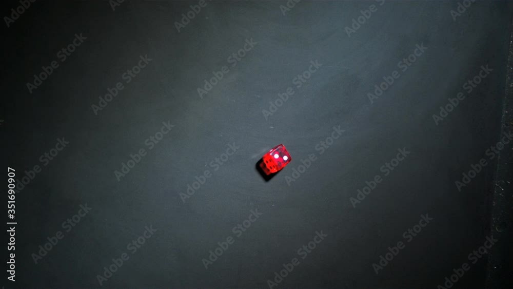 Red dice falling and bouncing