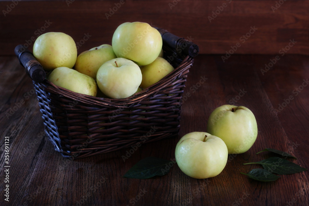 apples basket- Symbolic image. Concept for healthy nutrition. wooden background. Front view. Copy space.