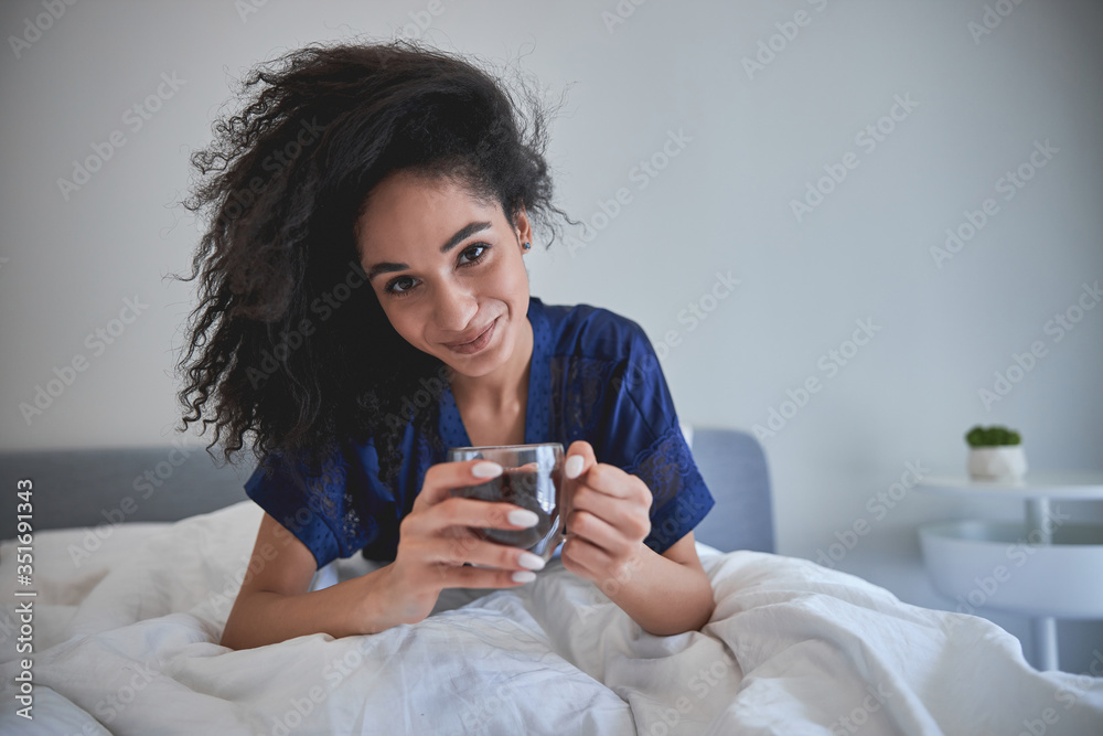 Tender female person going to drink coffee Tender female person going to drink coffee