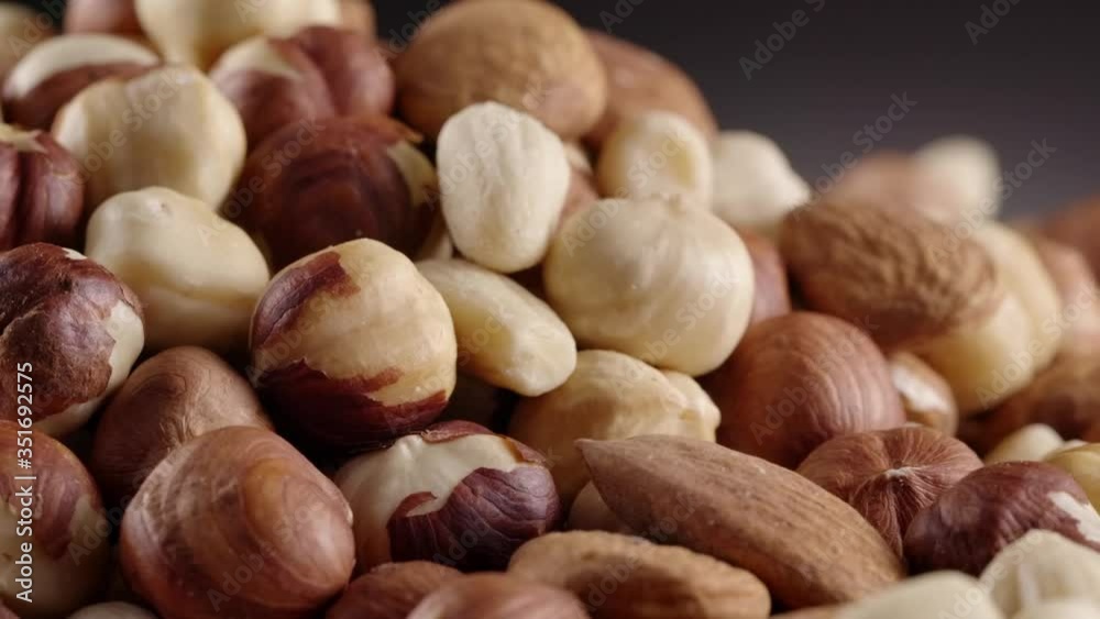 Nuts turning around, rotating. Nuts rotated. Rotation. Food. Almond, hazelnut, peanut, cashew. Slow motion, close up. Nuts turning around, rotating. Nuts rotated. Rotation. Food. Almond, hazelnut, peanut, cashew. Slow motion, close up.