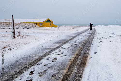 Empty highway countryside road with snow in winter in Iceland photo