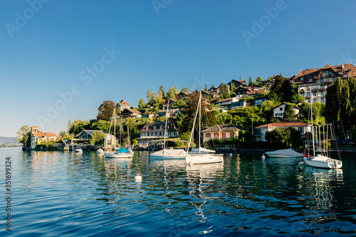 lake with yachts and mountains landscape