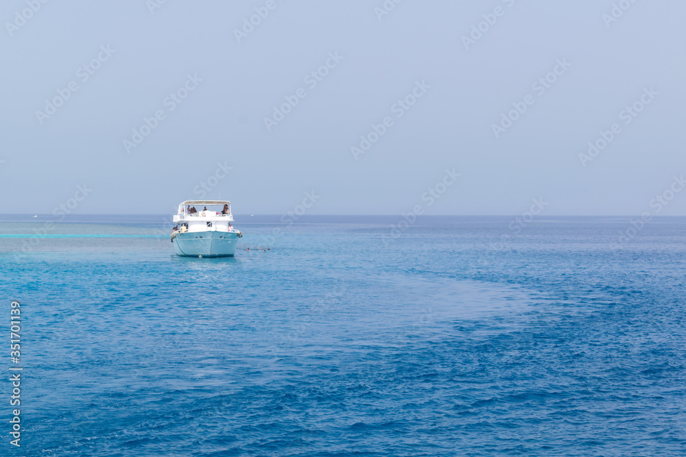 Boat yachting in the blue sea, landscape of ship in calm open ocean