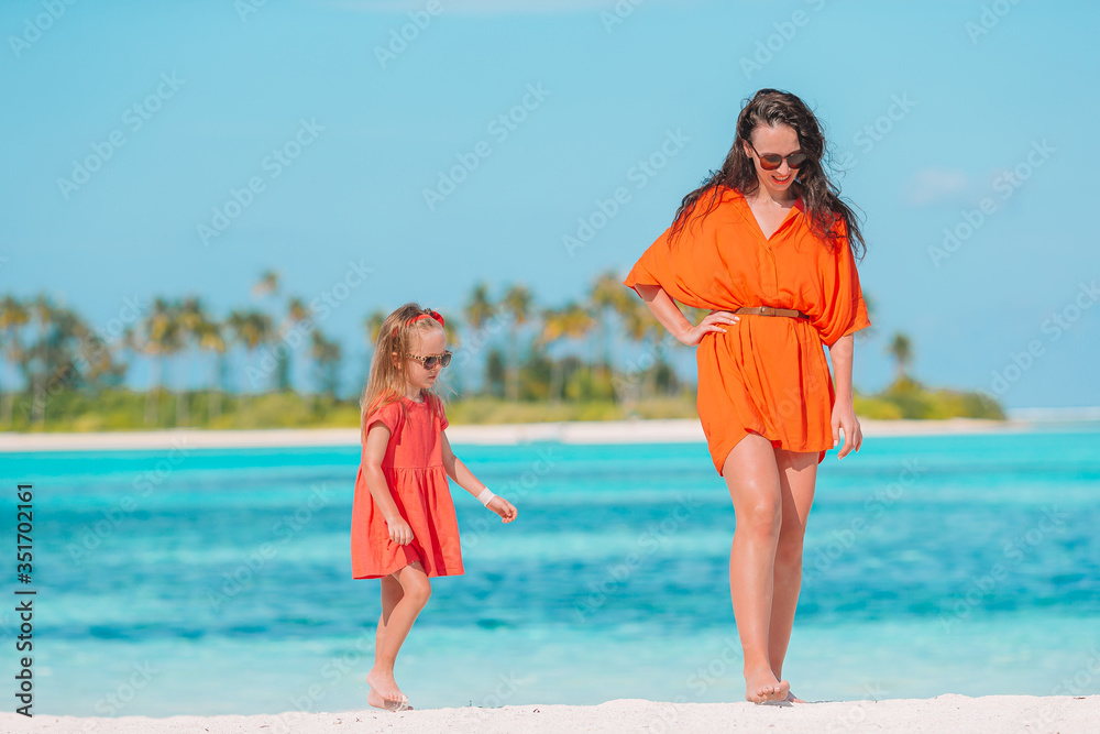 Beautiful Mother And Daughter At Caribbean Beach Enjoying Summer 