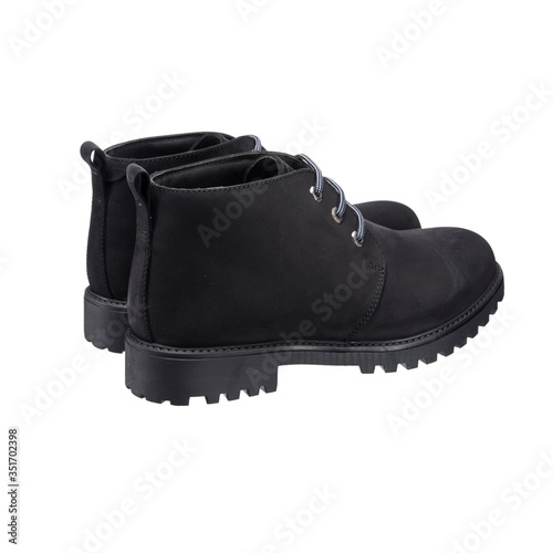black autumn shoes boots with lace-up tread isolated on white background
