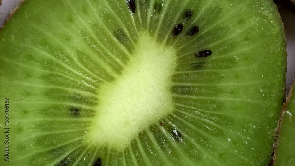 Rotating kiwi slice. Close-up of kiwi. Rotating kiwi slice. Close-up of kiwi.