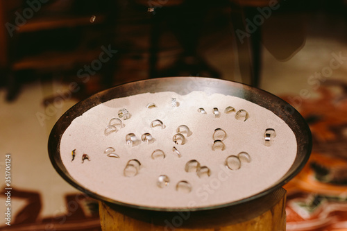 platinum rings showcase in sand background