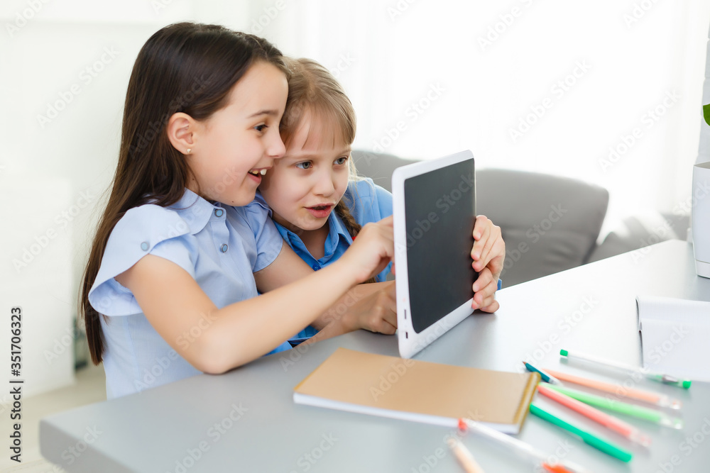 Learning from home, Home school kid concept. Little children study online learning from home with laptop. Quarantine and Social distancing concept. Learning from home, Home school kid concept. Little children study online learning from home with laptop. Quarantine and Social distancing concept.
