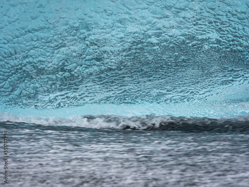 Ice structures on the black lava beach, placed near Jokulsarlon glacier lagoon.