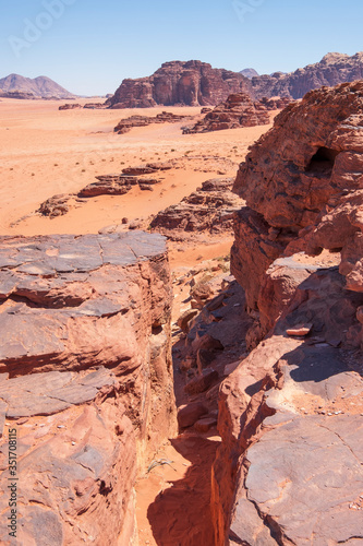 red desert with rocks Wadi Rum in Jordan during the day in the hot sun