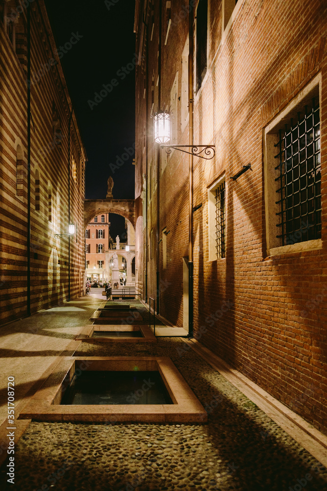evening italian streets in verona. evening italian streets in verona. Ancient buildings and old town streets of Italy