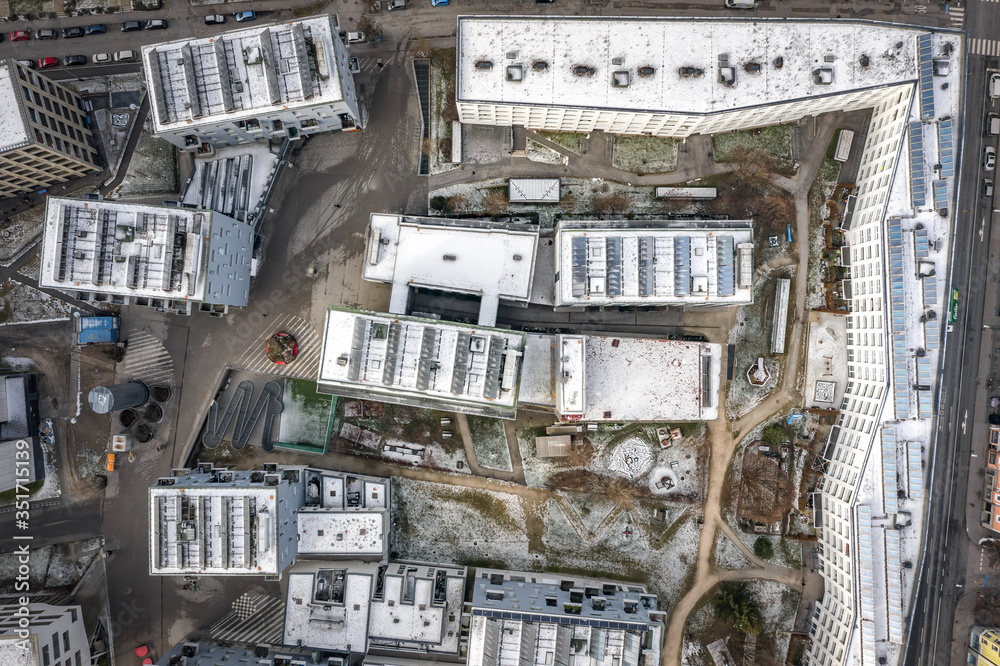 Aerial drone shot view of building complex with solar panels on