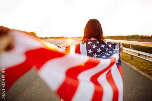 Фотография Woman holding USA flag