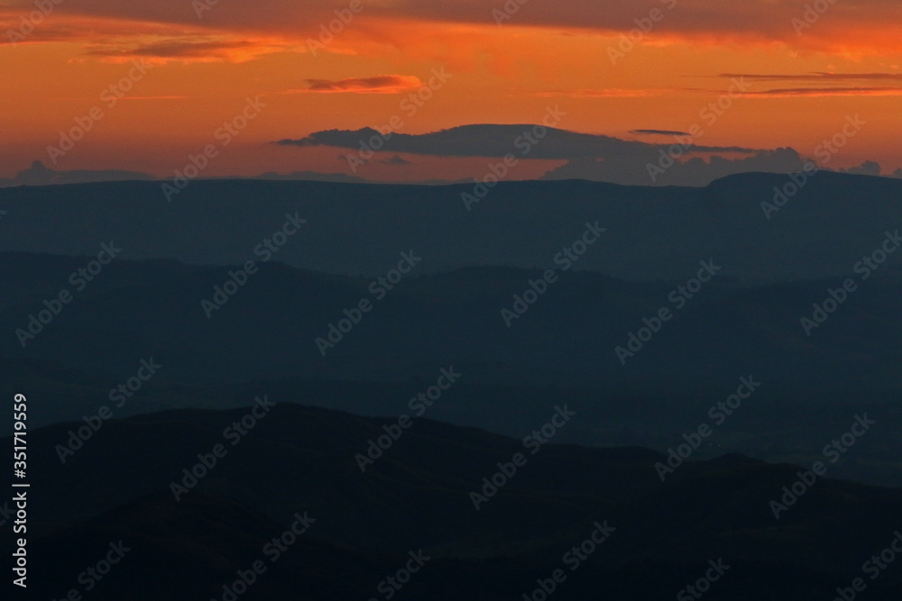 mountains and valleys during dusk