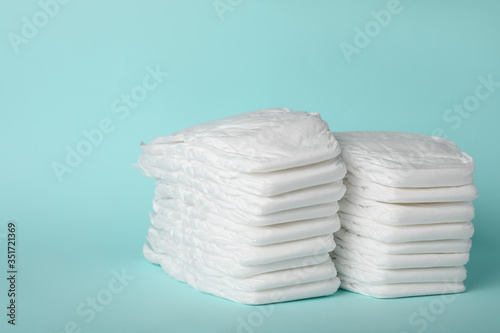 Wallpaper Mural Stacks of diapers on light blue background Torontodigital.ca