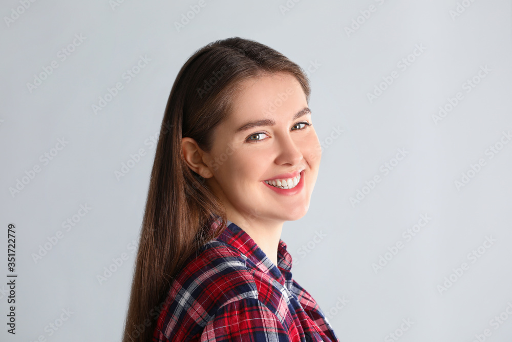 Portrait of young woman on light background Portrait of young woman on light background