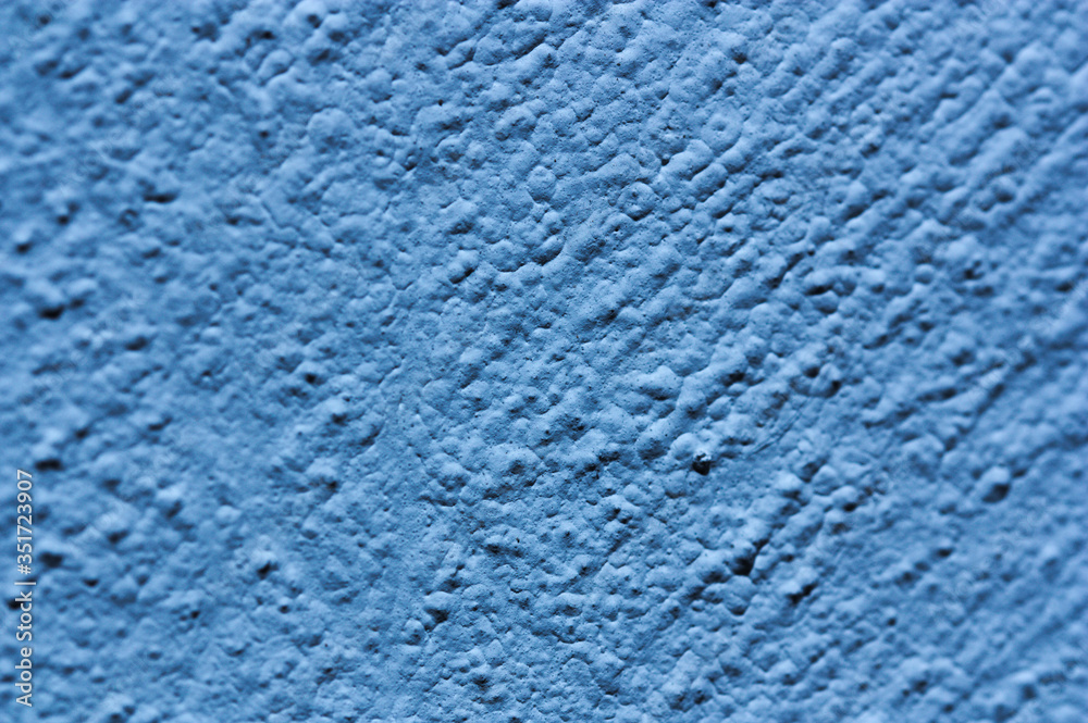 Blue wall with small lumps that make it rough Stock Photo | Adobe Stock