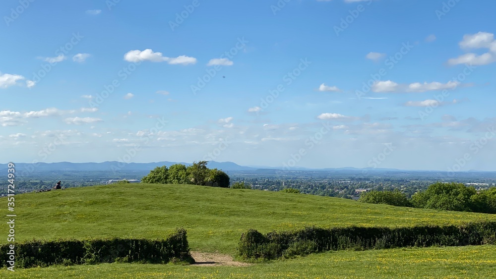 Obraz premium landscape with blue sky and natural hedge walls looking towards Wales.