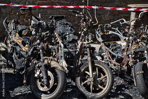 Fototapeta Naklejka Na Ścianę i Meble -  Close-Up Of Motorcycles Destroyed By Fire, vandalism