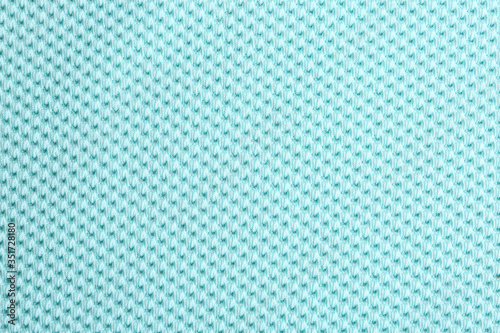 Textured light blue fabric as background, closeup